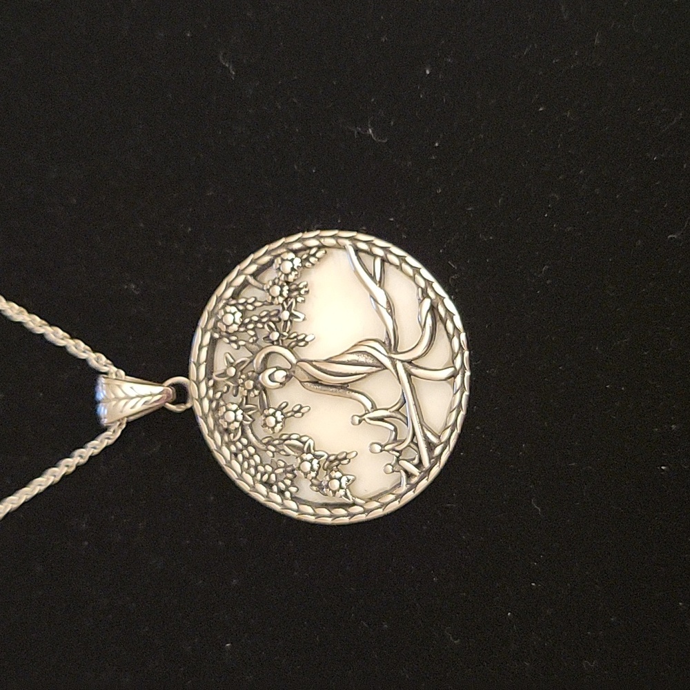 White Mother of Pearl pendant in Stainless Steel w/Stainless steel chain.